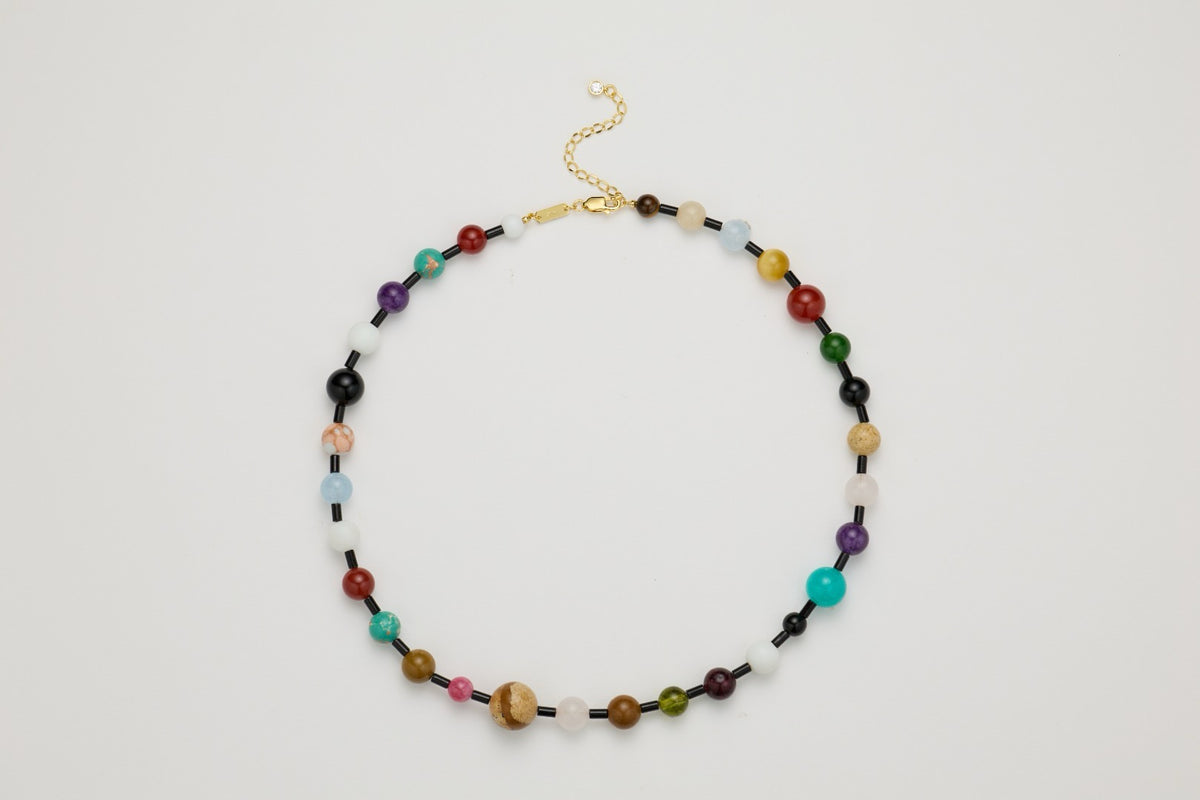Gaia multistone gemstone necklace flat lay with 18K gold vermeil details