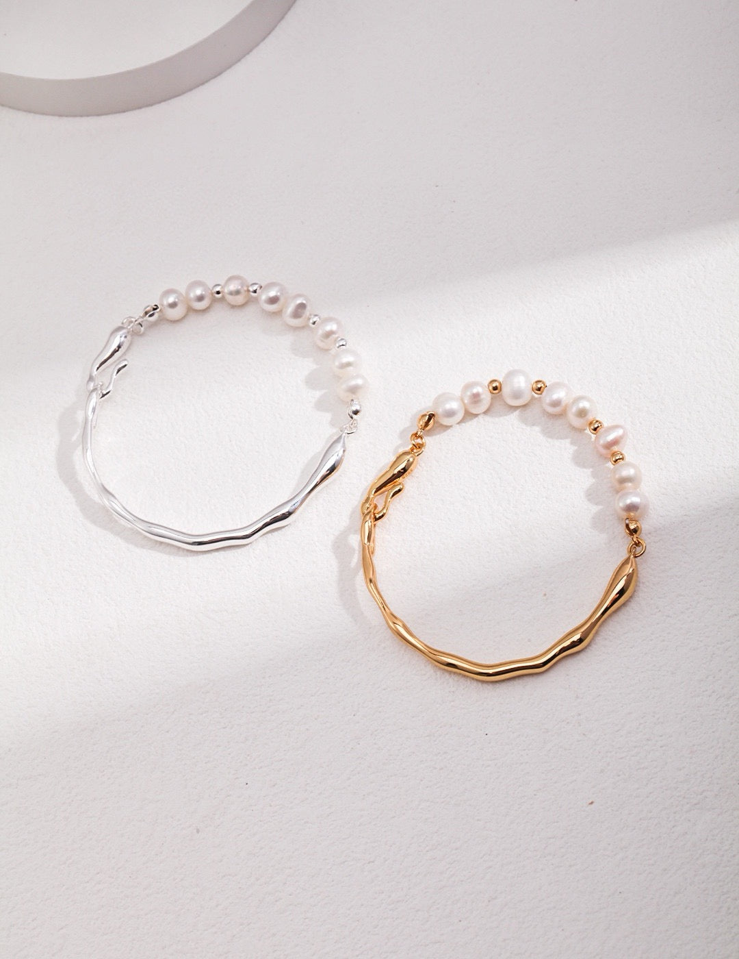 Front view of Caitlin Minimalist Freshwater Pearl Asymmetrical Bracelet In 18K Gold & Silver