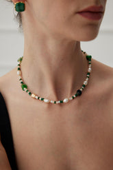 A model is wearing the Glimmer Agate & Malachite Necklace - Lia Atelier