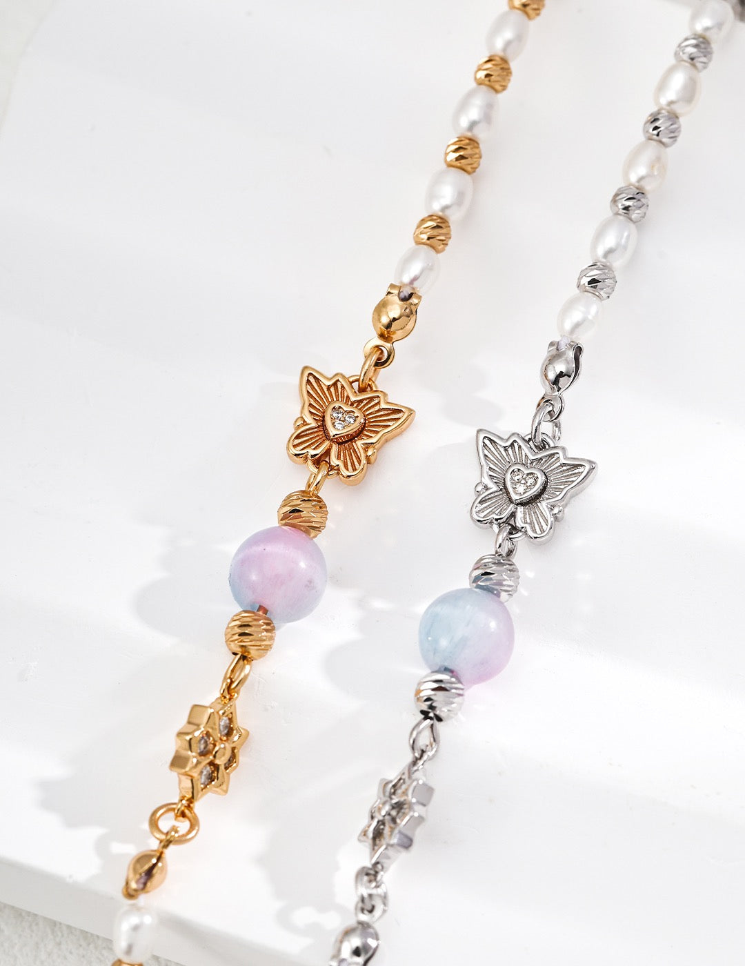 Chrysoberyl and freshwater pearl flower charm bracelet in sterling silver with zircon accents