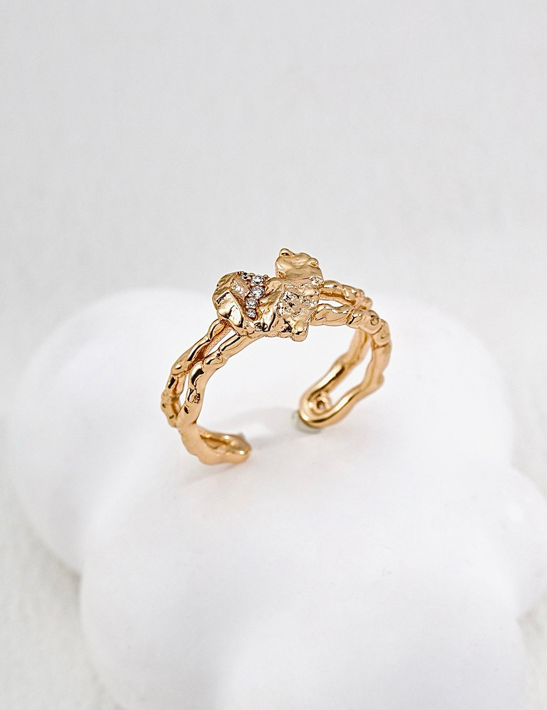 Adjustable gold open ring with crystal inlay for women.