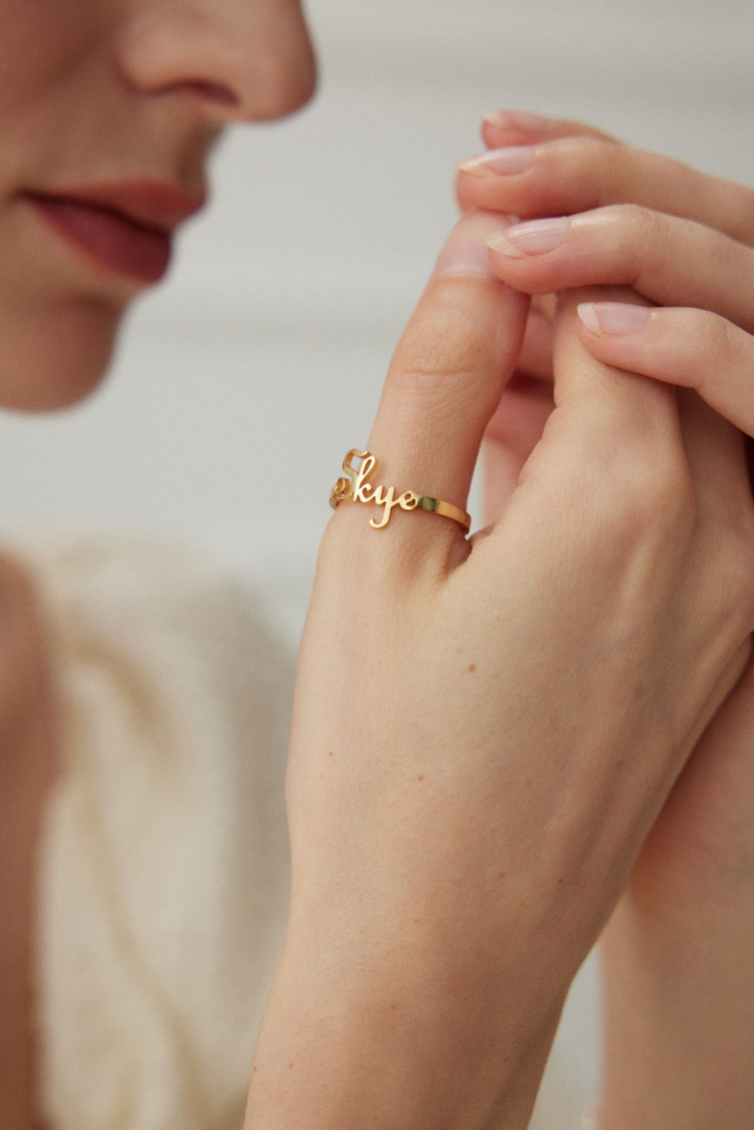 Custom double-script name ring in 18K gold vermeil on model