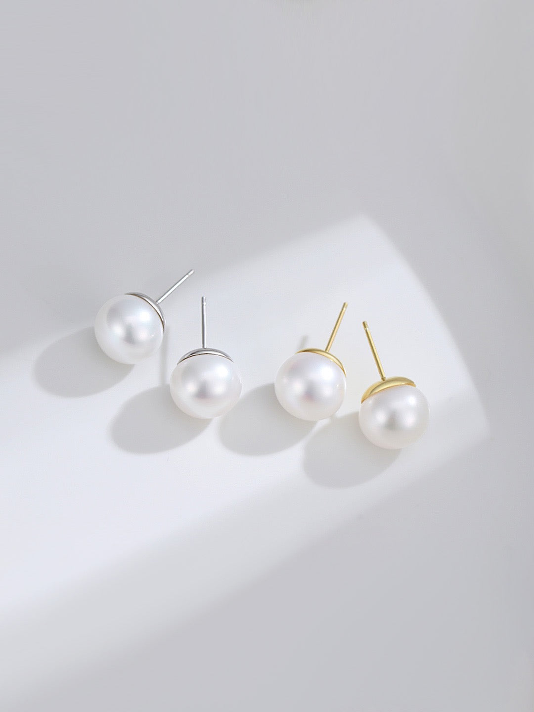 11mm large Pearl earrings on a light gray background