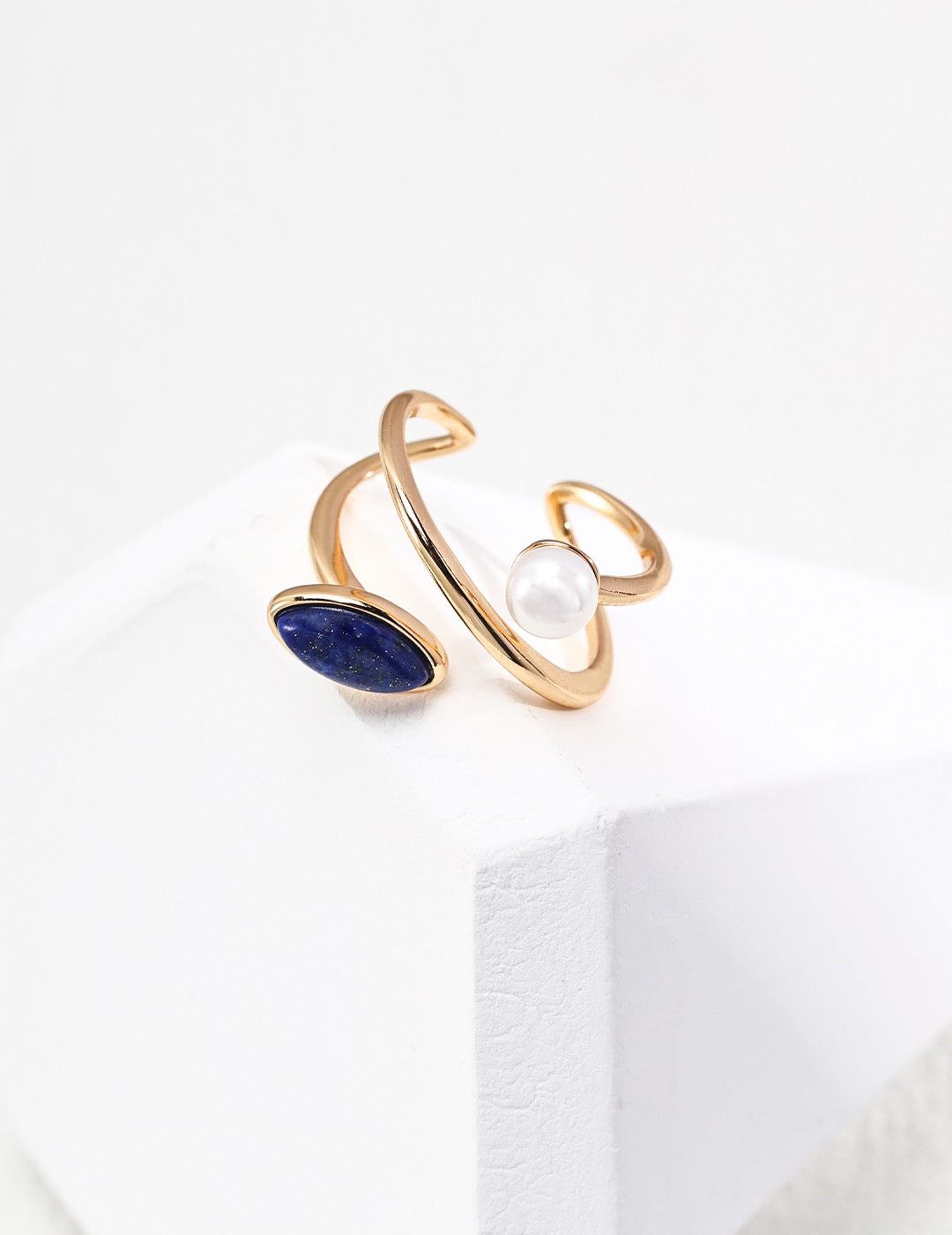 Lapis lazuli and freshwater pearl adjustable ring set in 18K gold vermeil displayed side by side
