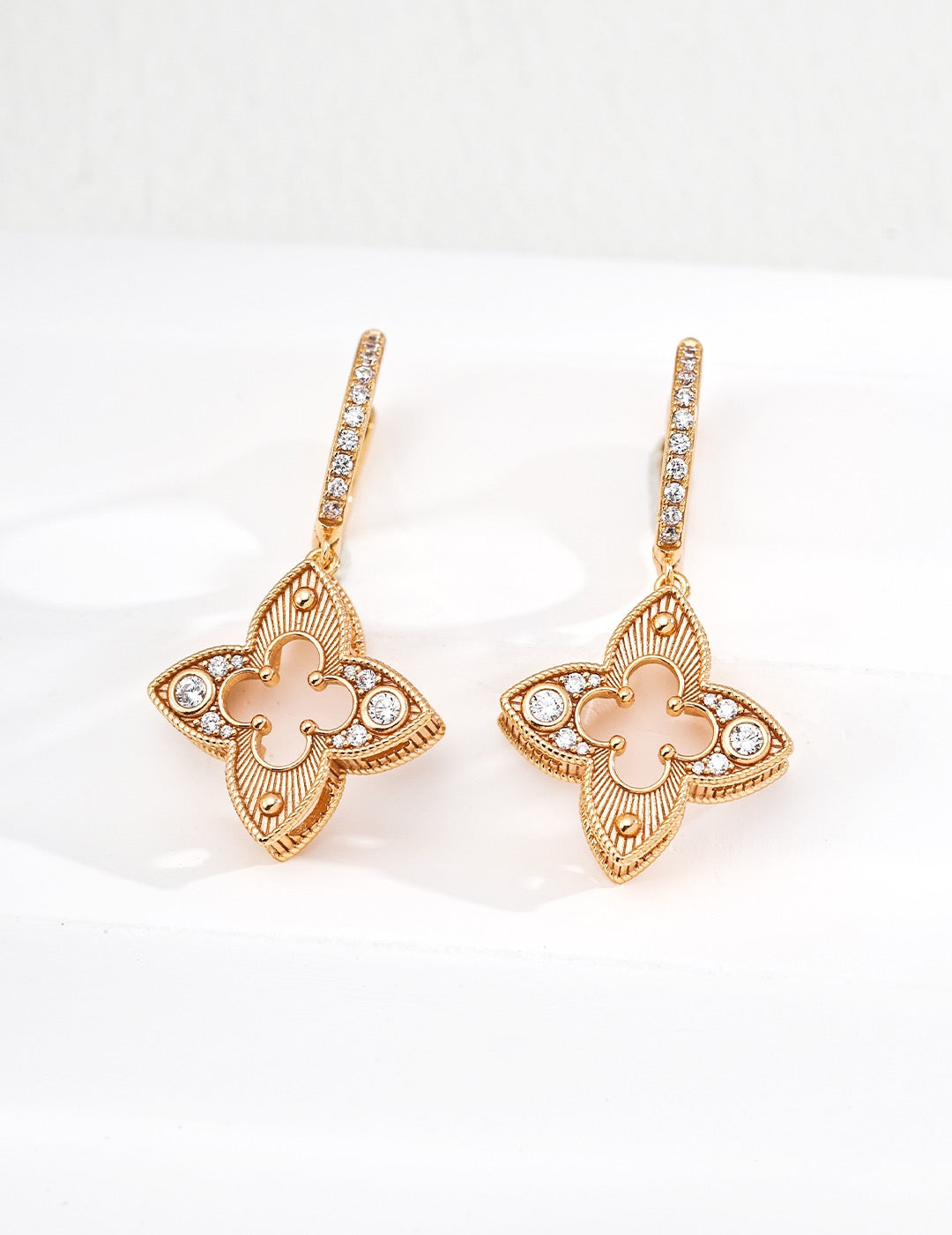 Four Leaf Clover drop earrings in 18K gold vermeil with milgrain detail and zircon accents