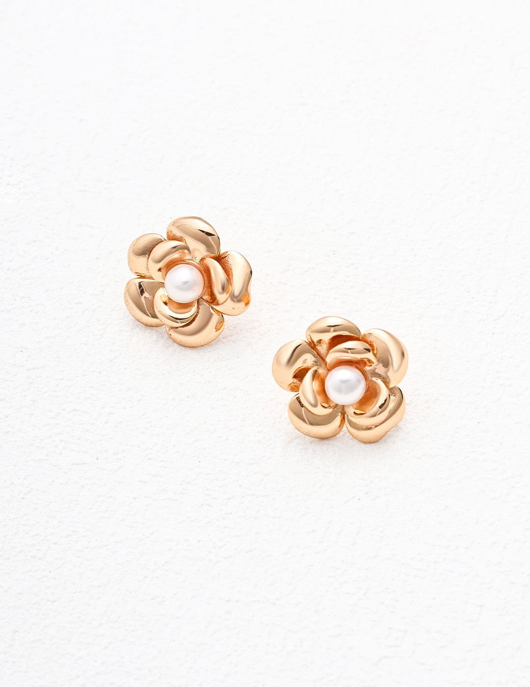 Gold Josie Stud Pearl Earrings displayed on the white background.
