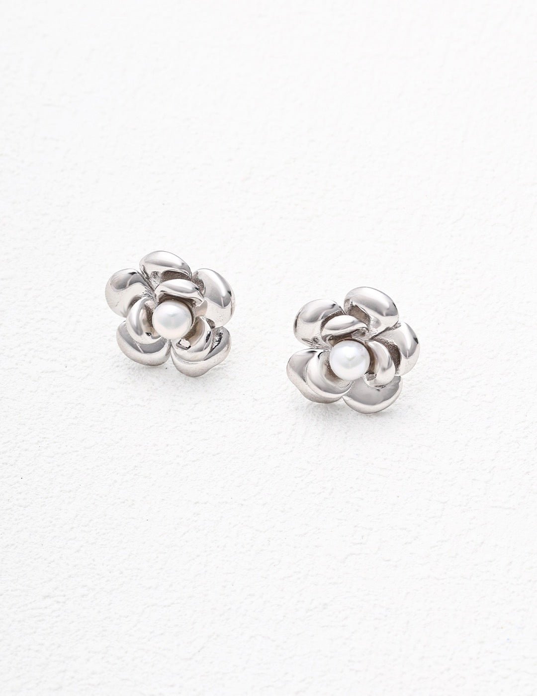 Silver Josie Stud Pearl Earrings displayed on the white background.