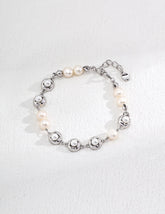 Orbit Pearl Link Bracelets in Sterling Silver display on the white background, showcasing the minimalist design.