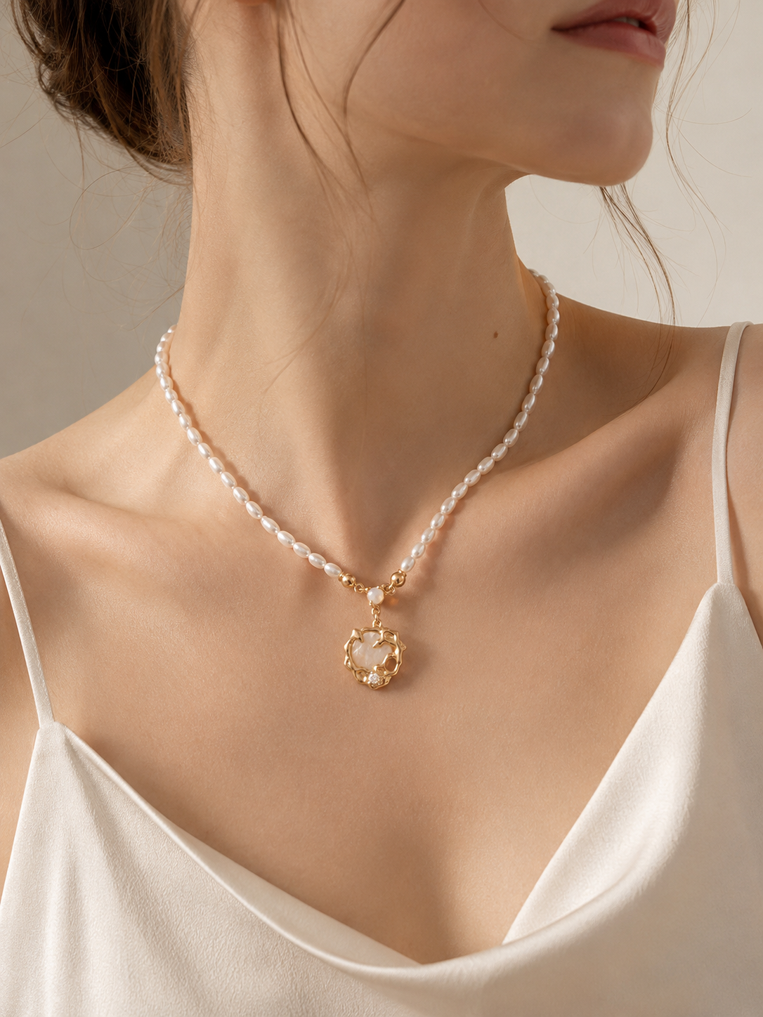 Pearl strand shell pendant necklace worn on model — Lia Atelier baroque freshwater pearl choker with 18K gold vermeil shell medallion pendant