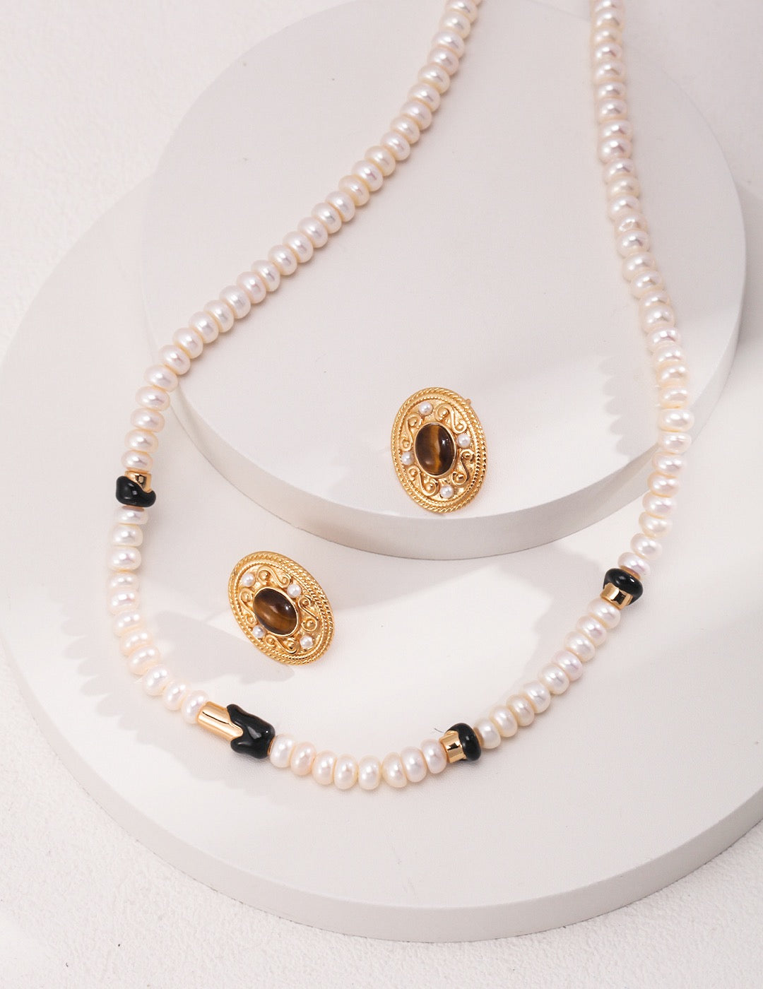 Ceres 18K Gold Freshwater Pearl Black Enamel Necklace, focusing on its elegant pearl and black enamel alignment.