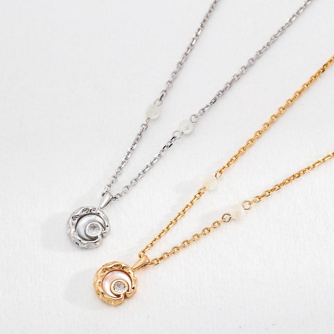 Sterling silver and gold Rayna Pendant Necklaces displayed on the white background