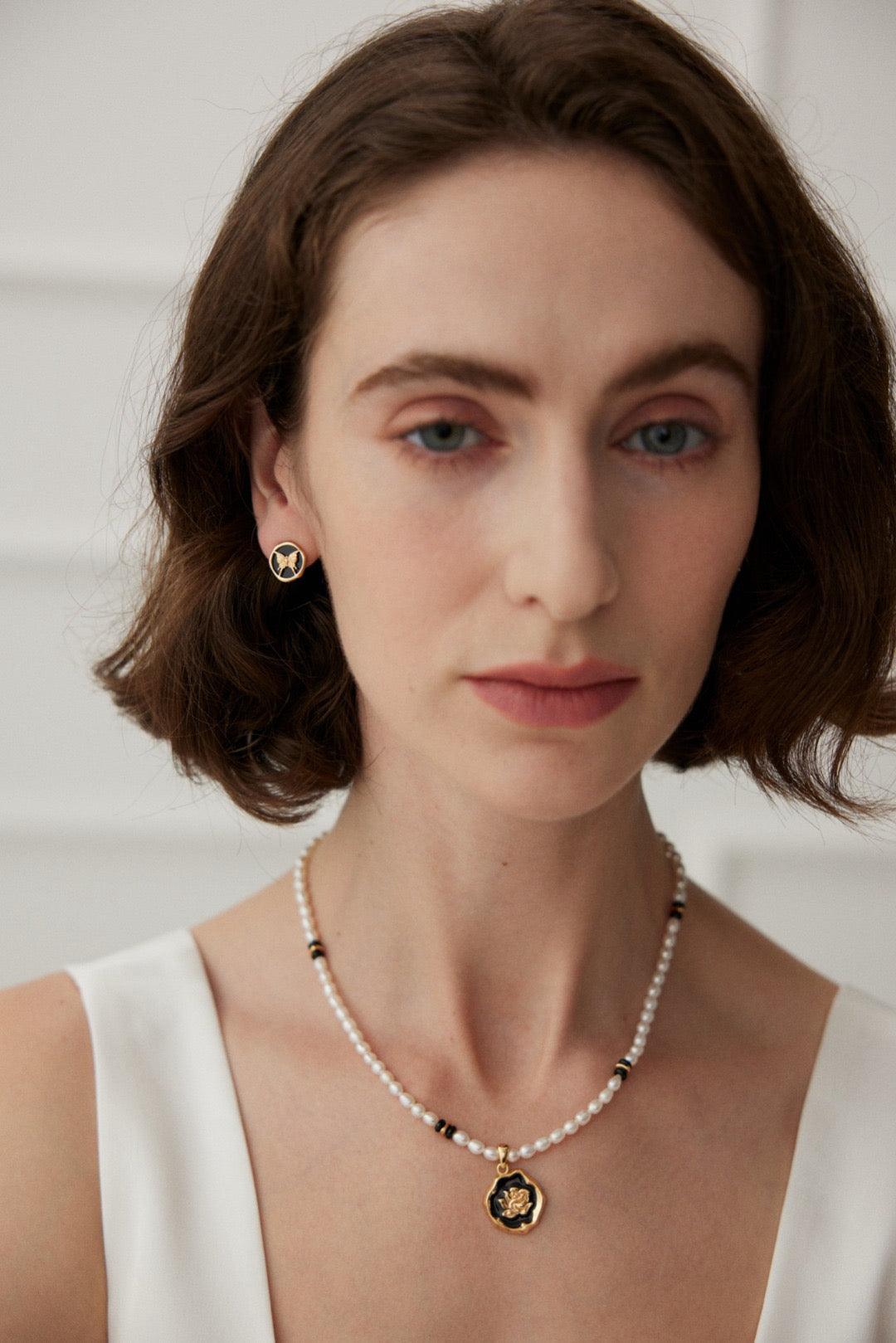 The Rosanna Pendant Necklace wear by a women in a white soiree dress