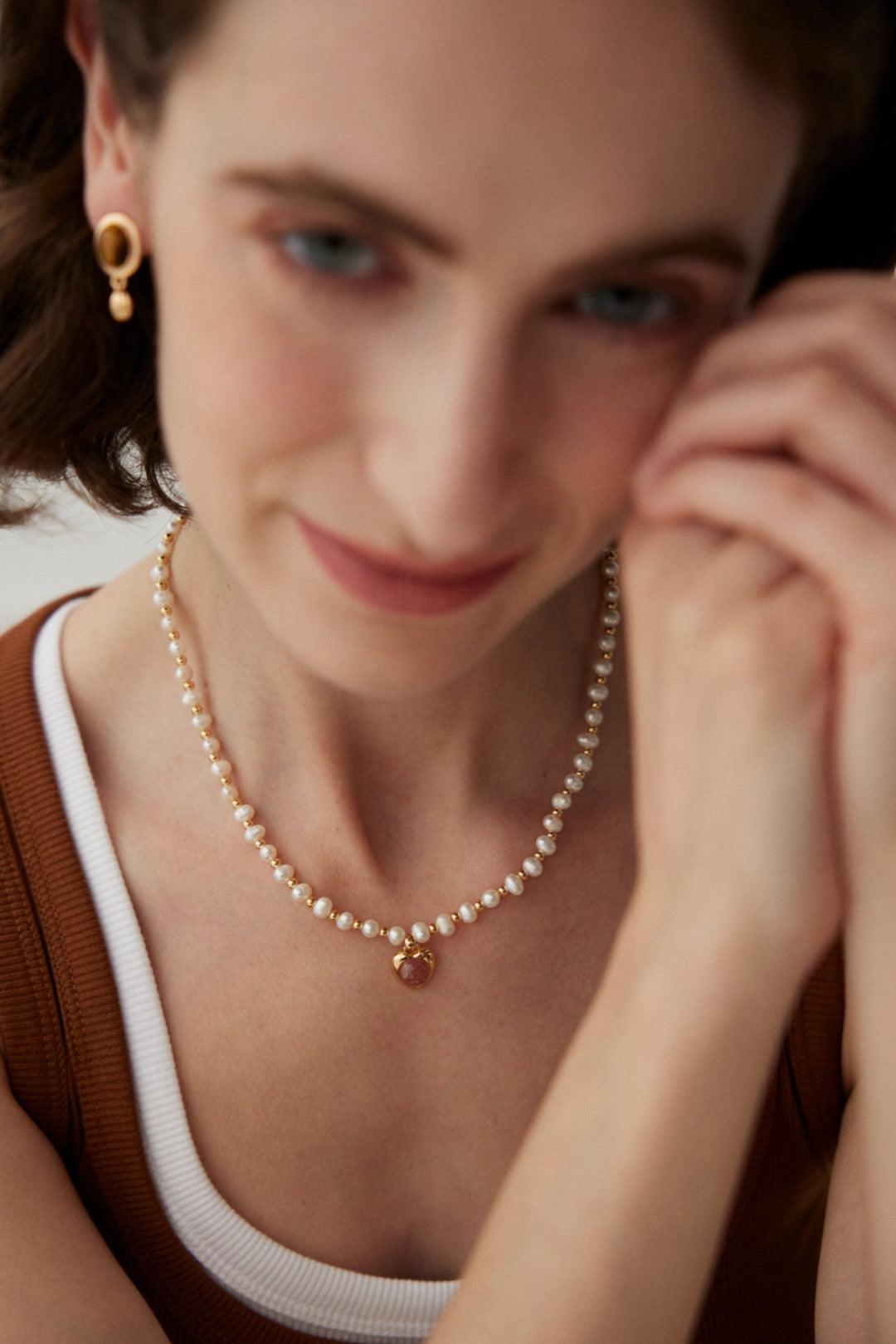Strawberry Quartz Pearl Necklace worn by a woman.