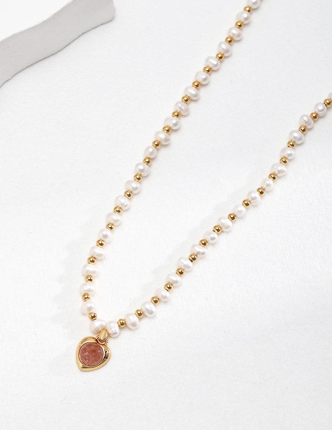 Close-up of the pendant of the Strawberry Quartz Pearl Necklace