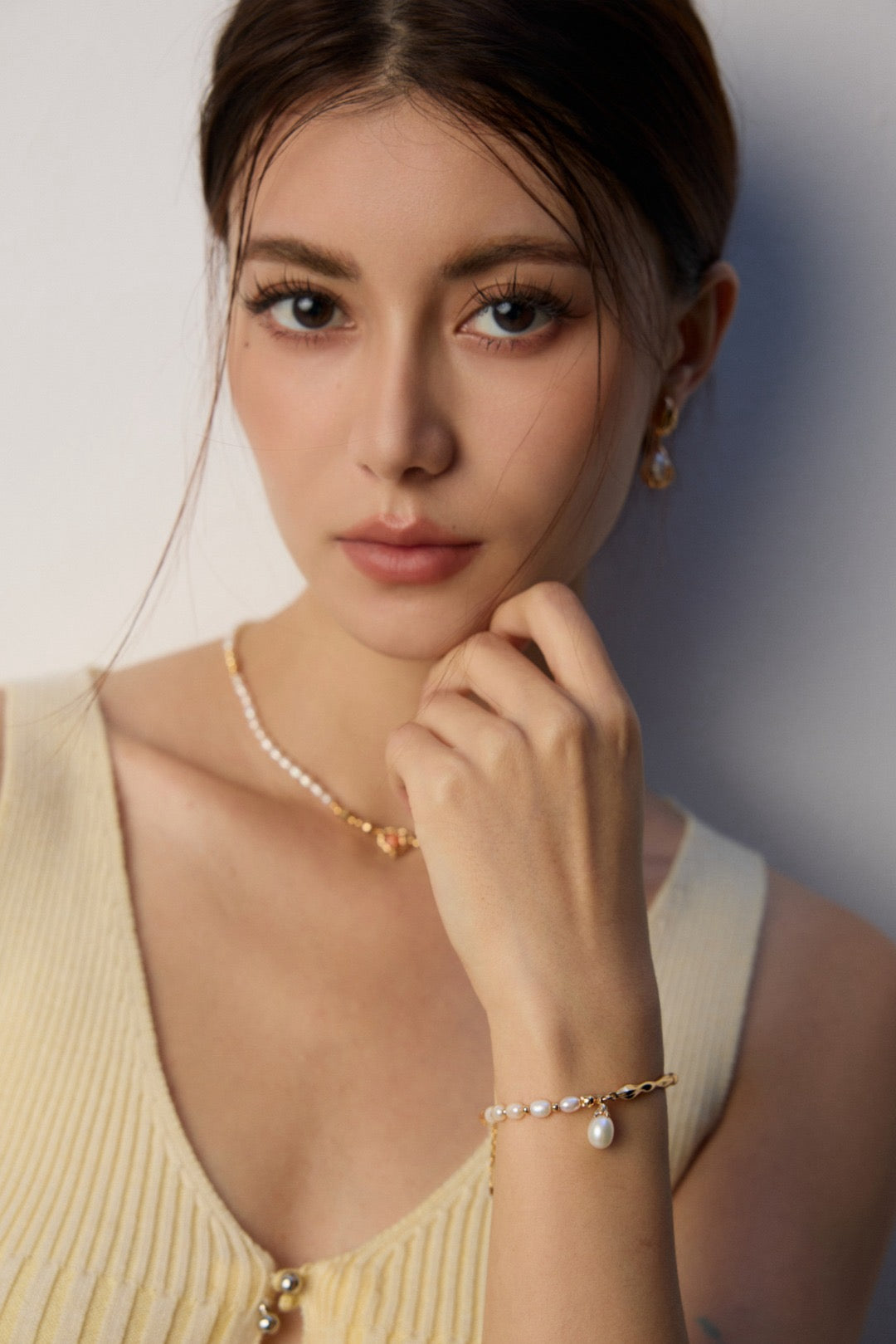 Celestial Harmony Pearl Bracelet with mixed freshwater pearls & 18k gold vermeil waves wear by a woman 