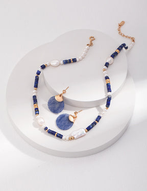 Necklace with blue and white beads on a white background