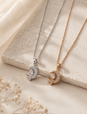 Gold vermeil and sterling silver crescent moon crystal necklaces displayed together