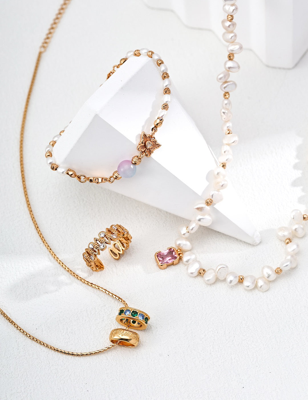Chrysoberyl pearl bracelet in gold and silver displayed together