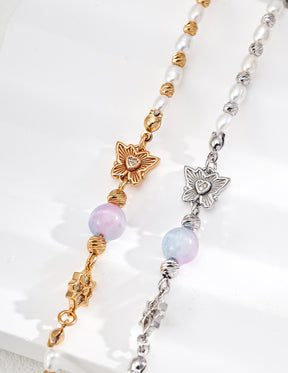 Chrysoberyl and freshwater pearl flower charm bracelet in sterling silver with zircon accents