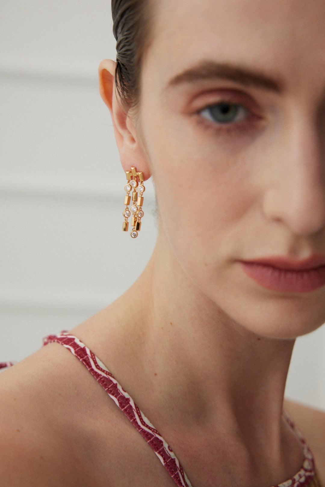 Clara Tassel Earrings wear by a women.