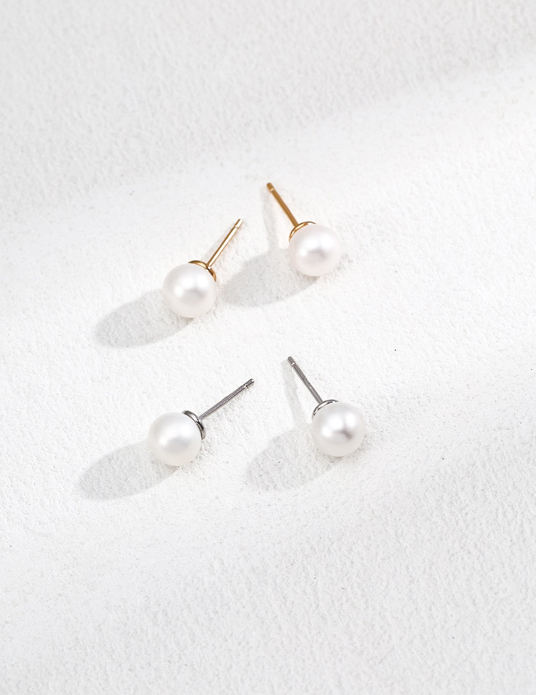 Pearl earrings on a white background