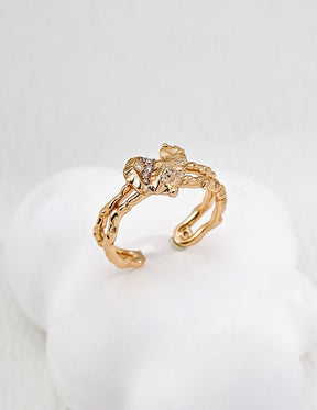 Adjustable gold open ring with crystal inlay for women.