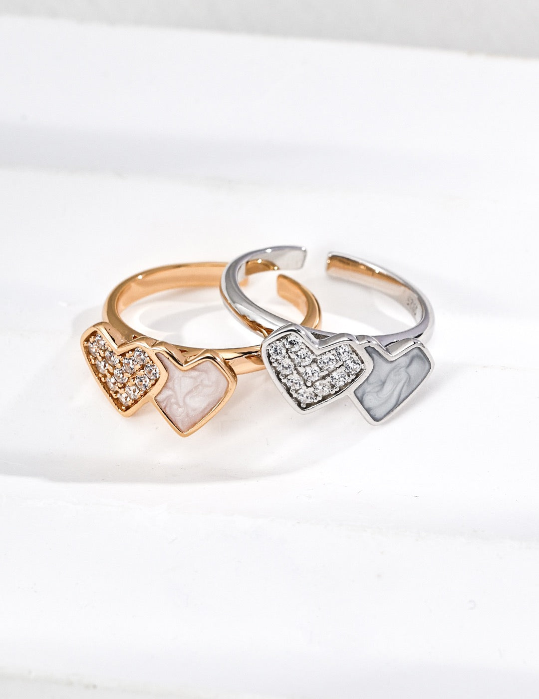 Double Heart Open Ring for women, with zircon and mother of pearl design.
