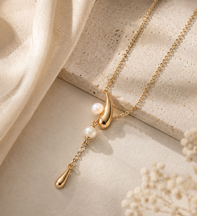 18K gold vermeil adjustable pearl lariat necklace displayed on a neutral background