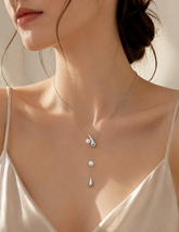 Sterling silver Eira Pearl Drop Lariat Necklace worn on a model