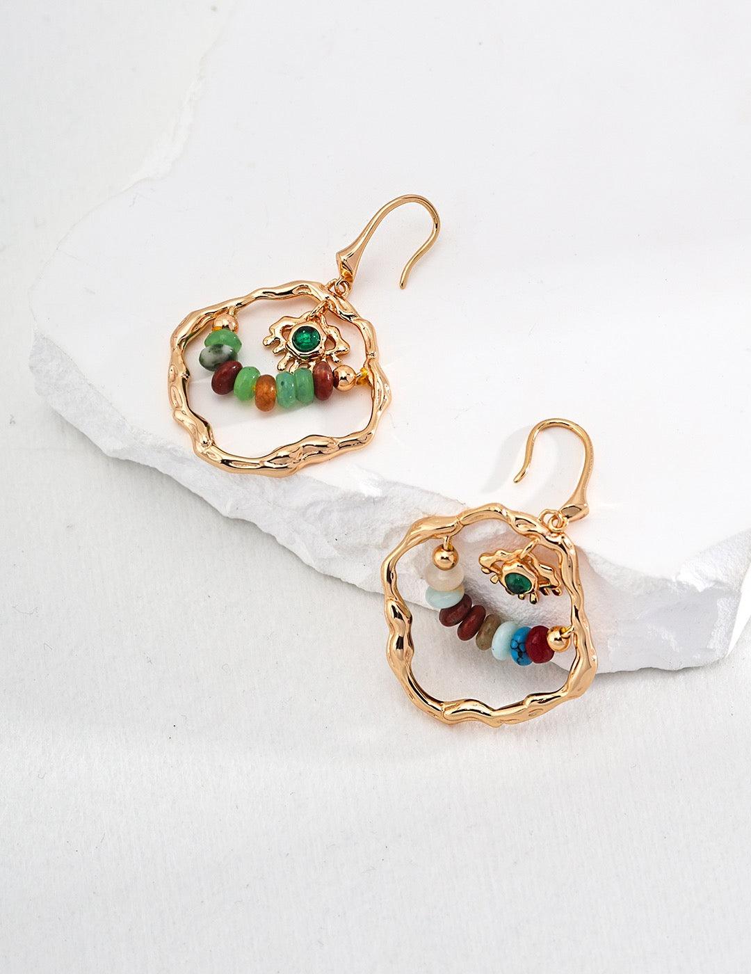 Eleanor Earrings displayed on the white rock.