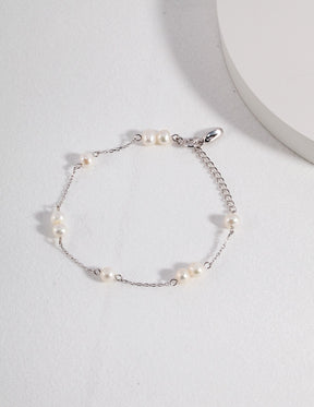 Minimalist Sterling Silver Freshwater Pearl Bracelet displayed on a white background 