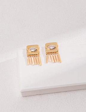 Inez Zircon Tassels Earrings displayed on the white rock.