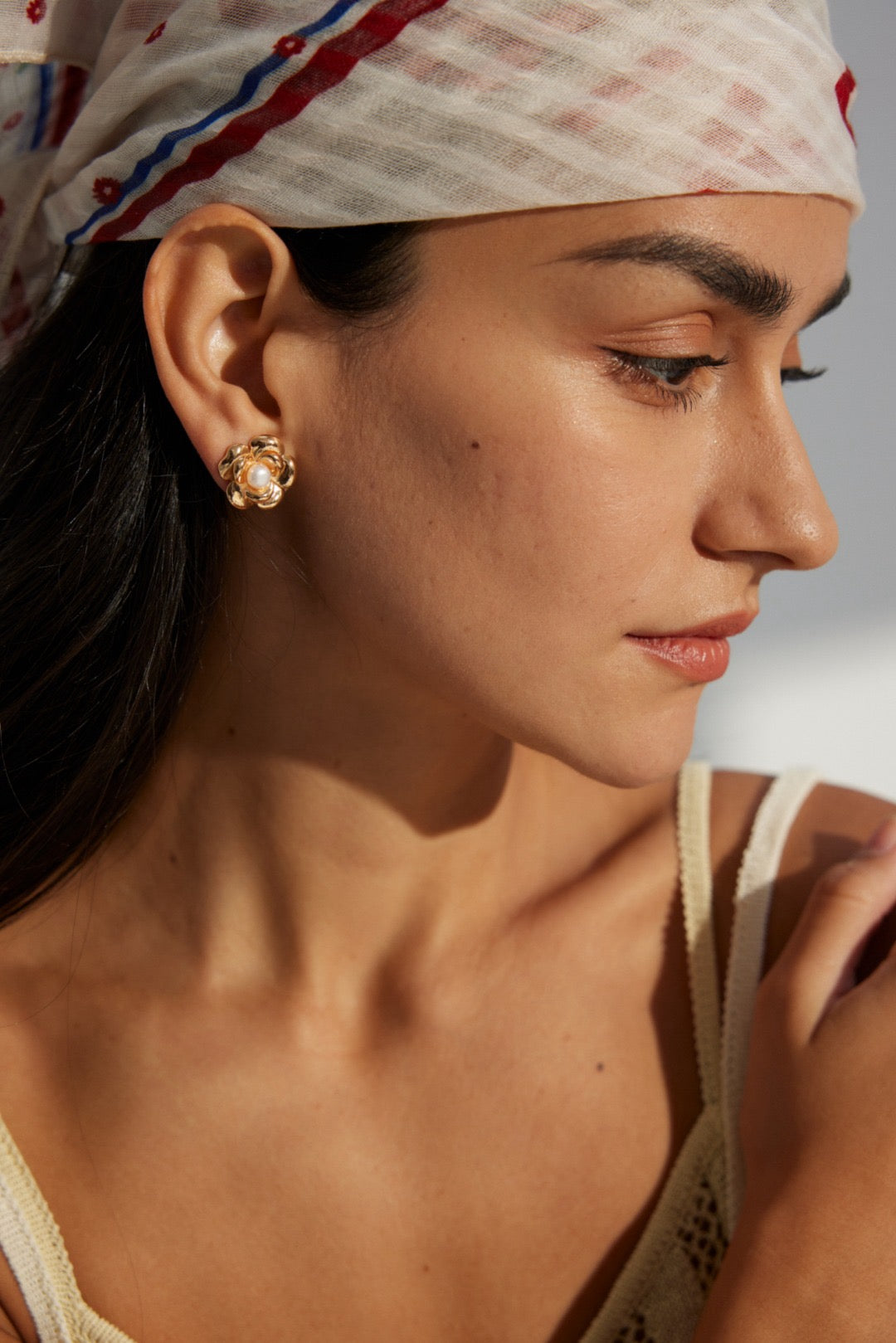 Josie Stud Earrings wore by a woman.