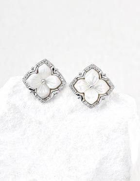 close up of Mother of Pearl Clover Studs in sterling silver displayed on the white rock