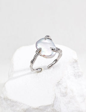 Sterling Silver baroque open ring with a central gemstone on a white background