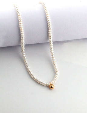 Minimalist Pearl Strand with Gold Accent displayed on the neutral background 