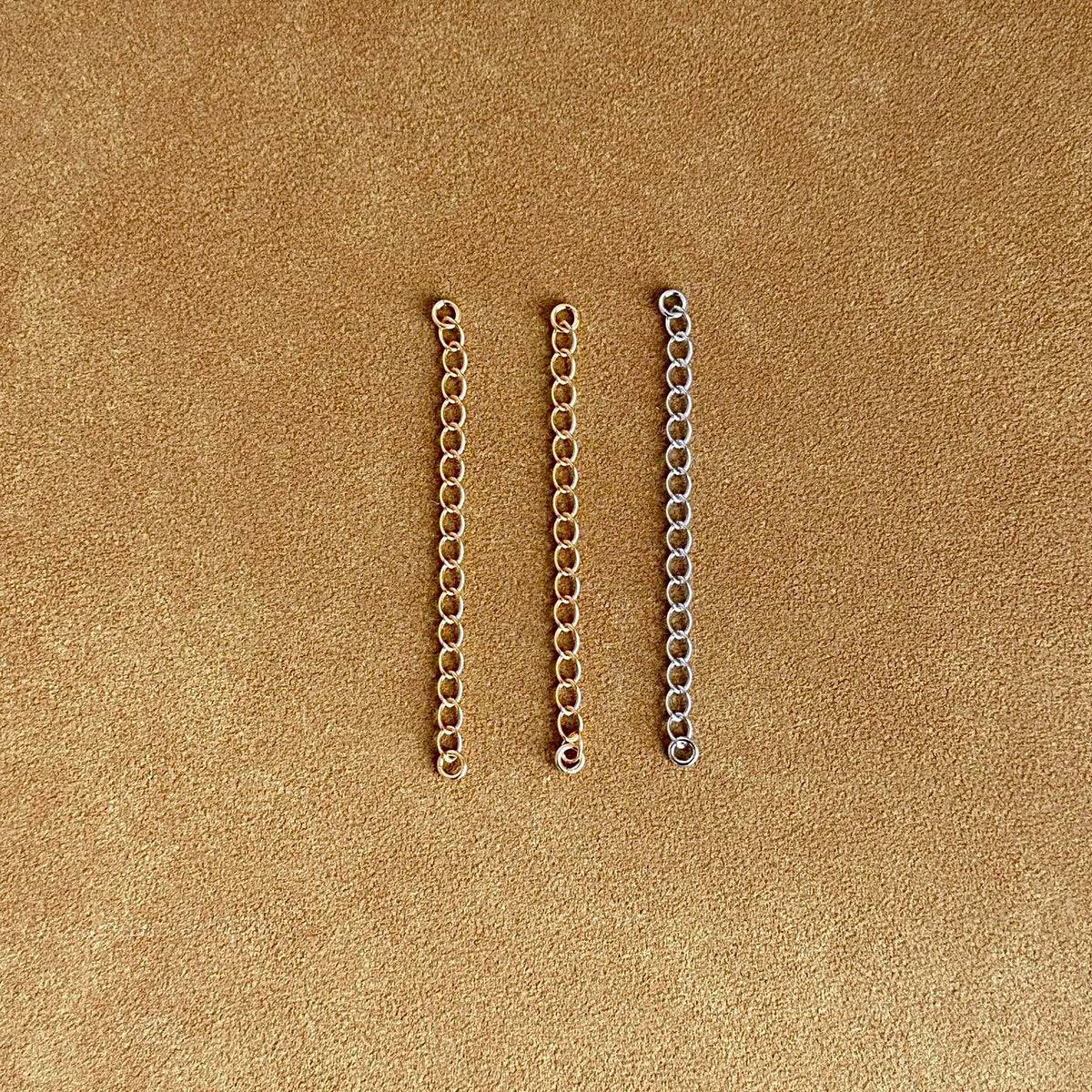 Sterling silver and 18k gold chain extensions for necklace.