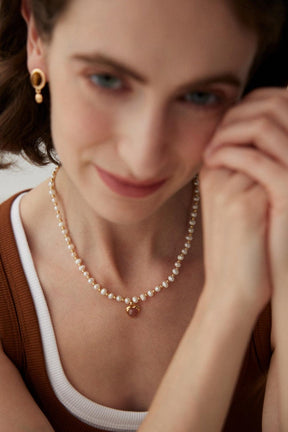 Strawberry Quartz Pearl Necklace worn by a woman.