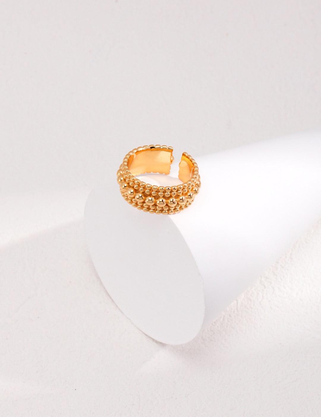 The Agnes Gold Open Ring displayed on a white ring display stands - Lia Atelier