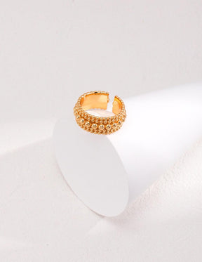 The Agnes Gold Open Ring displayed on a white ring display stands - Lia Atelier