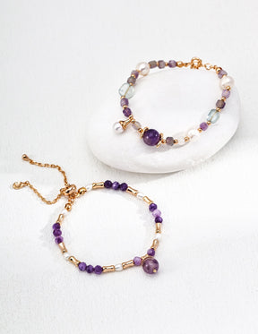 Two beaded bracelets with purple amethysts on a white background