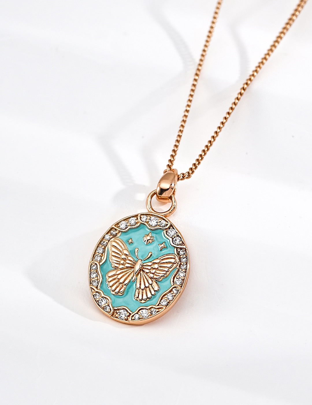 Necklace with a butterfly Tiffany blue pendant on a  white background