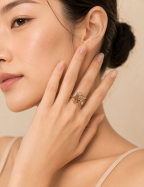 Woman wearing the Elowen Radiant Bloom adjustable floral open ring