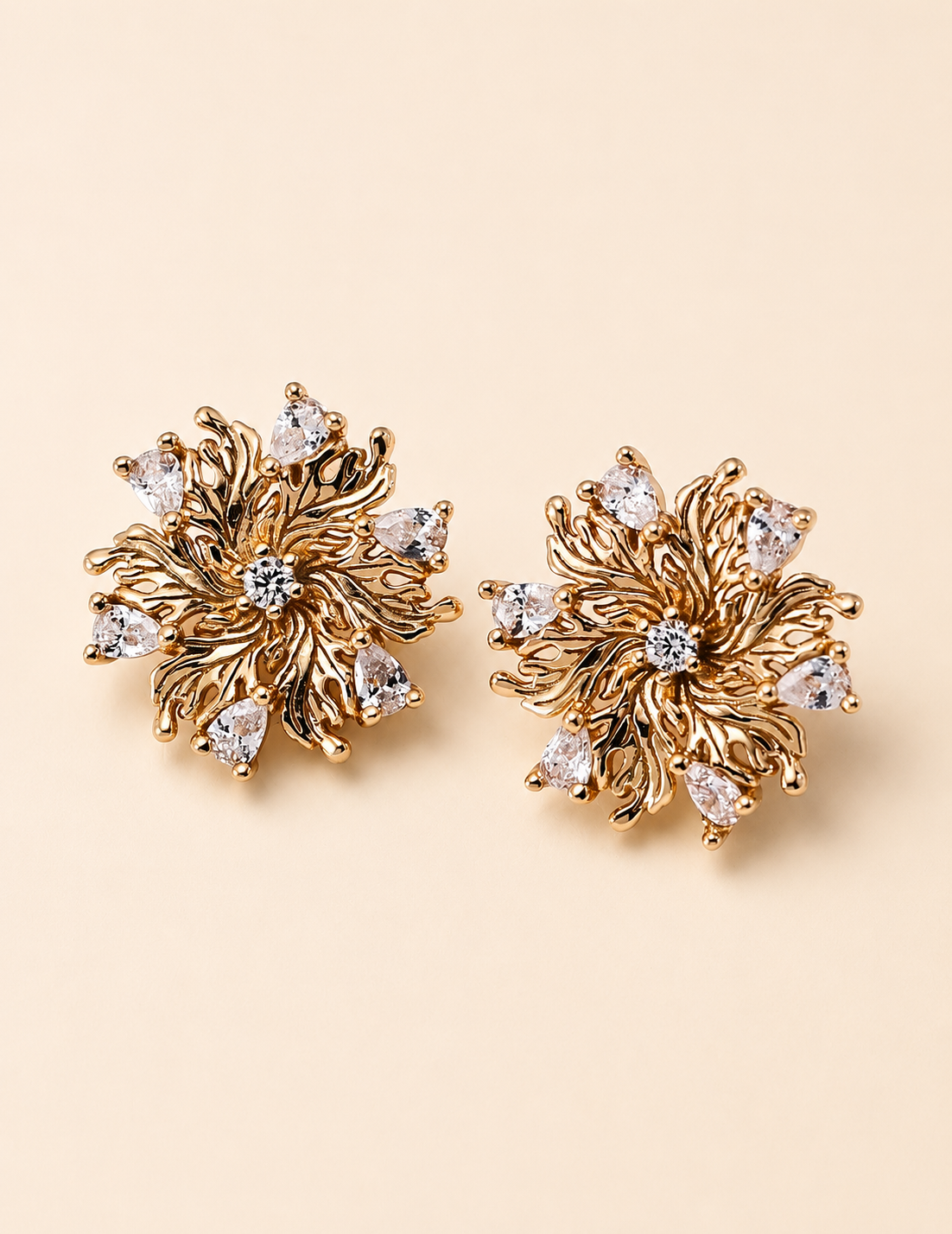 Close-up of Elowen Radiant Bloom earrings in 18K gold vermeil and zircon