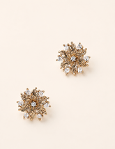 Elowen Radiant Bloom zircon flower stud earrings on an ivory background